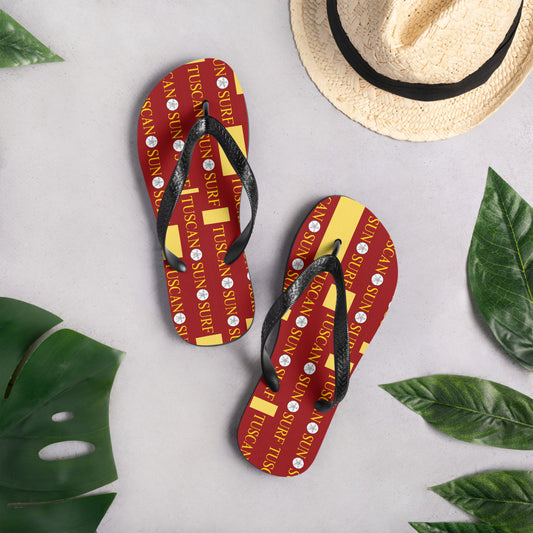 terracotta and yellow flip flops with Tuscan Sun Surf brand logo and black straps
