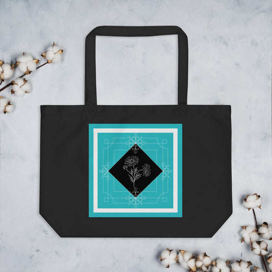 Black large size eco tote bag with a teal color square that has a dainty outline of daisy flowers inside the square