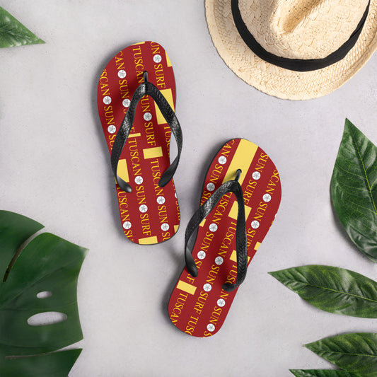 terracotta and yellow flip flops with Tuscan Sun Surf brand logo and black rubber straps